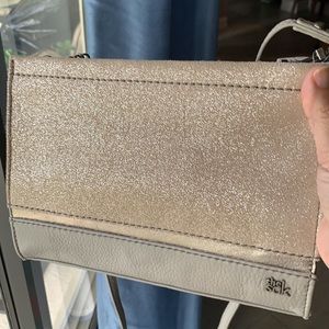 The Sak Itis Demi Clutch in soft leather